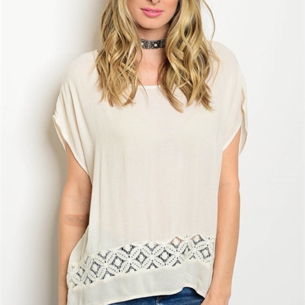 Short sleeve scoop neck crochet detail blouse.